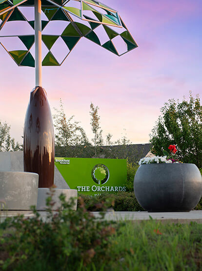 The Orchards community sign along walking path